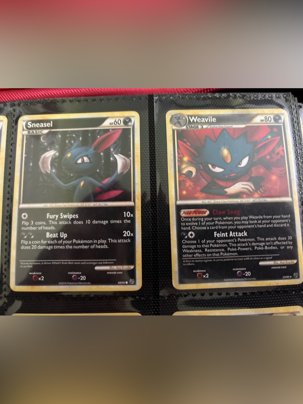 Undaunted Sneasel and Weavile Pokémon Card Pair - Black & Red Accents